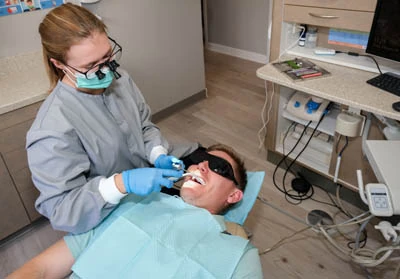 patient getting an emergency dental procedure to help restore his smile