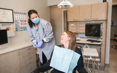 patient sitting in the dental chair at Strive Dental Studio during her teeth whitening appointment